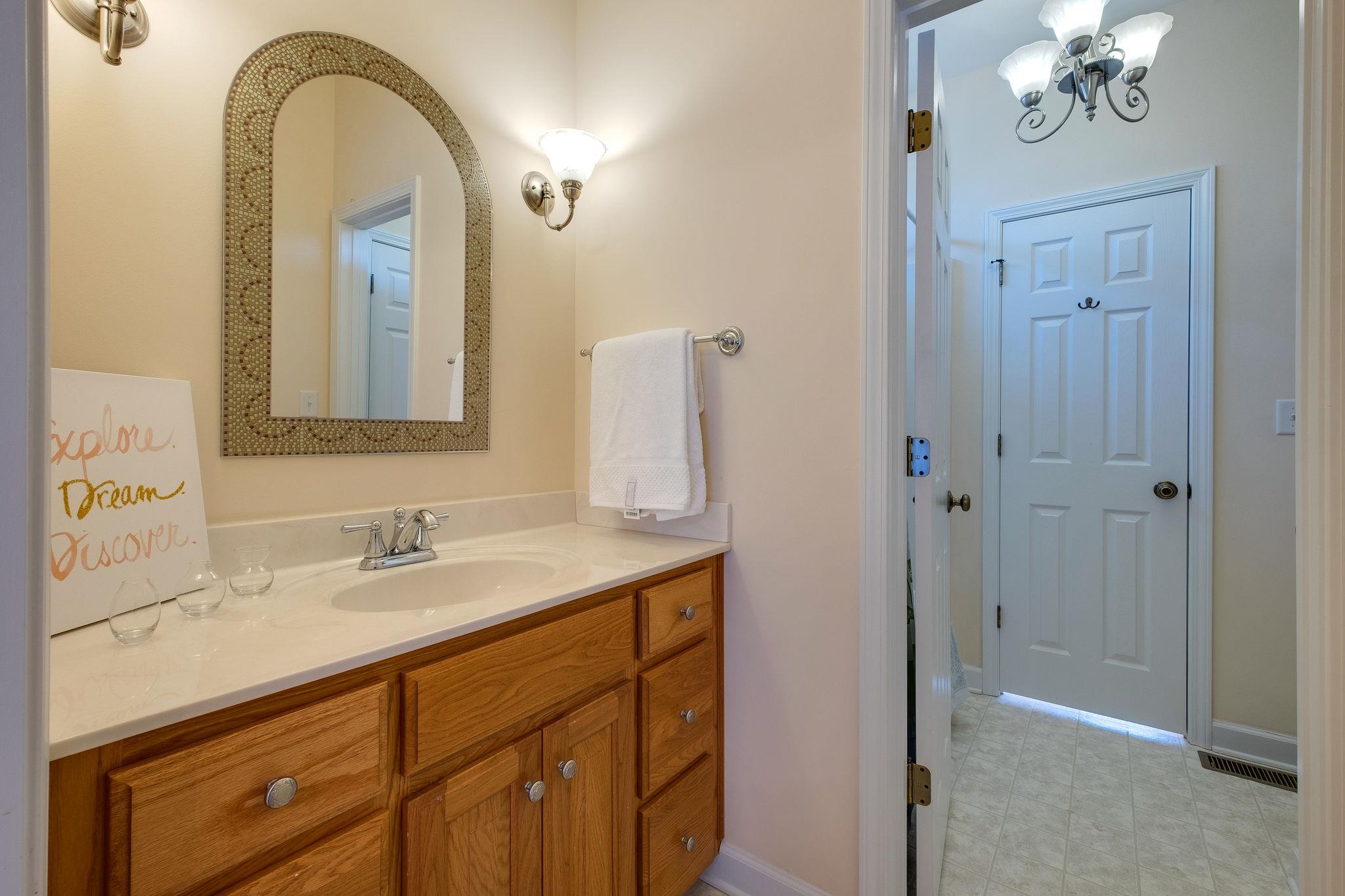1175 Tidwell Switch Road Dickson, TN 37055 - Photo 21 of 27 a bathroom with a double vanity sink and a mirror