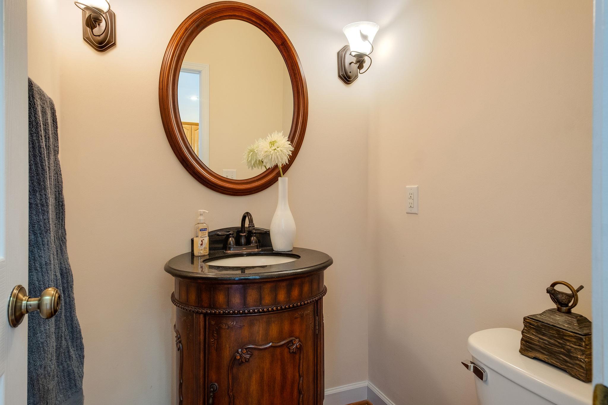 1175 Tidwell Switch Road Dickson, TN 37055 - Photo 23 of 27 a bathroom with a sink and a mirror