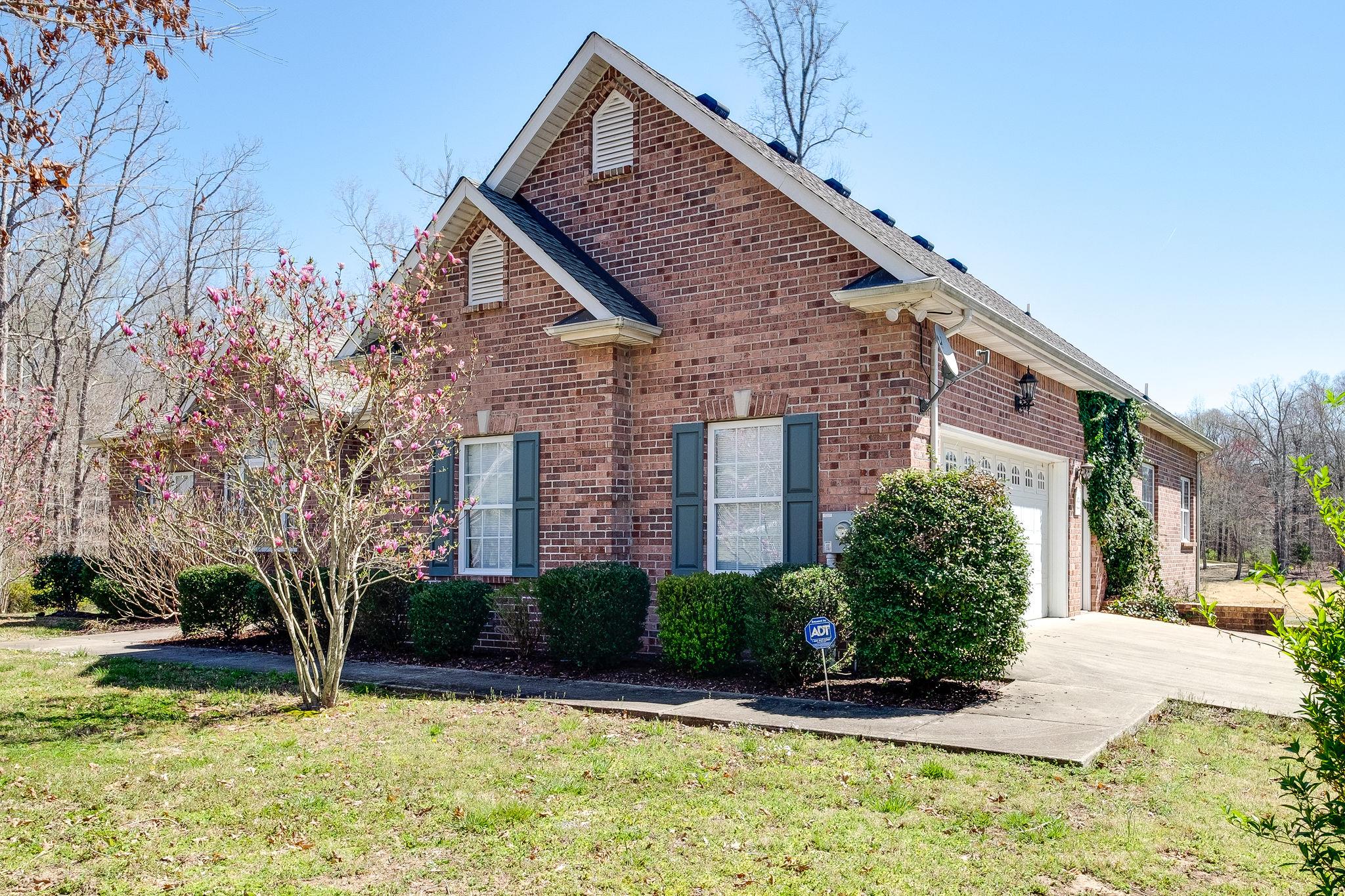 1175 Tidwell Switch Road Dickson, TN 37055 - Photo 25 of 27 a front view of a house with a yard