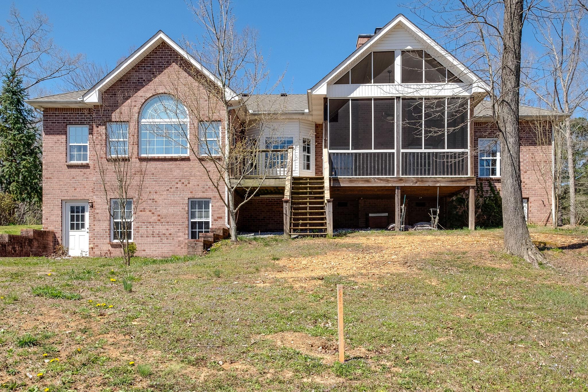 1175 Tidwell Switch Road Dickson, TN 37055 - Photo 26 of 27 a front view of a house with a yard