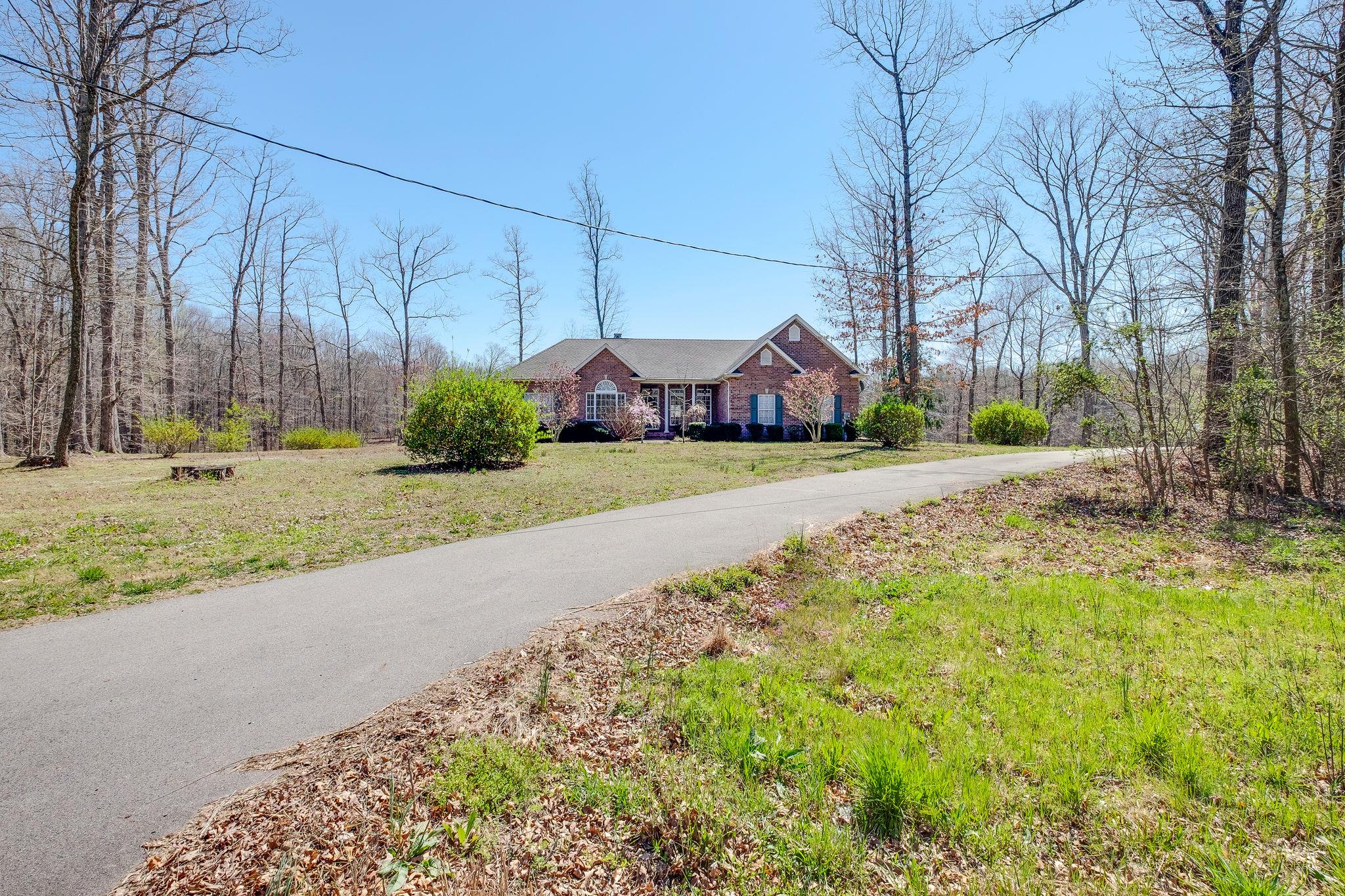 1175 Tidwell Switch Road Dickson, TN 37055 - Photo 27 of 27 a front view of a house with a yard and pathway