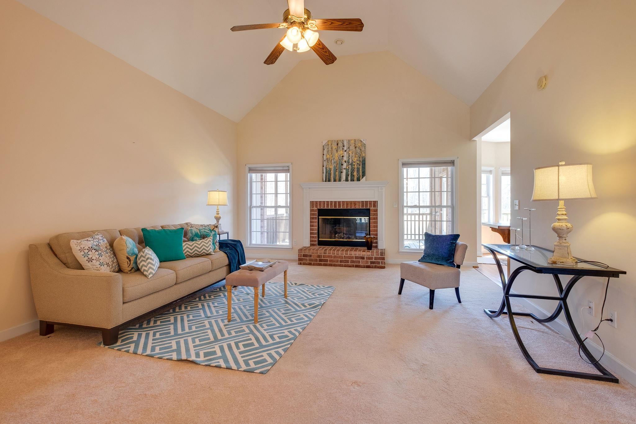 1175 Tidwell Switch Road Dickson, TN 37055 - Photo 7 of 27 a living room with furniture and a fireplace