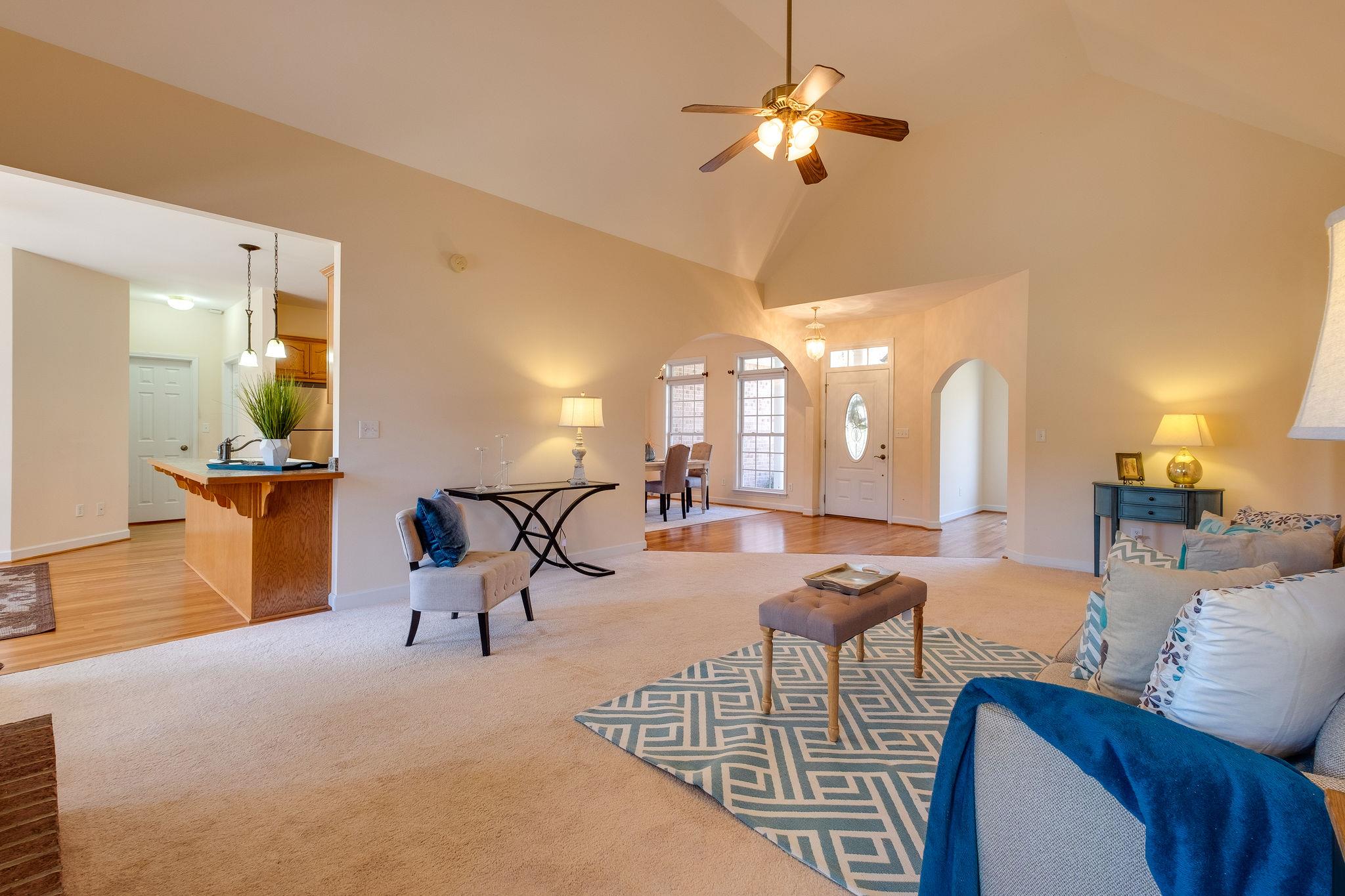 1175 Tidwell Switch Road Dickson, TN 37055 - Photo 9 of 27 a living room with furniture a dining table and a chandelier