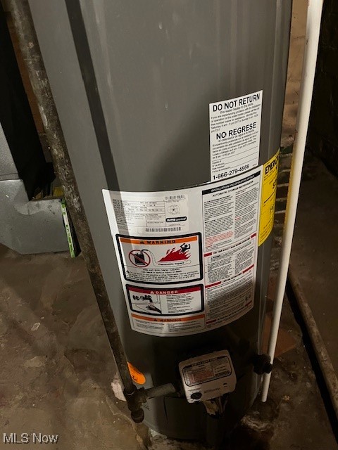 362 Howe Street Akron, OH 44307 - Photo 22 of 23 Basement view of water heater and unfinished concrete flooring
