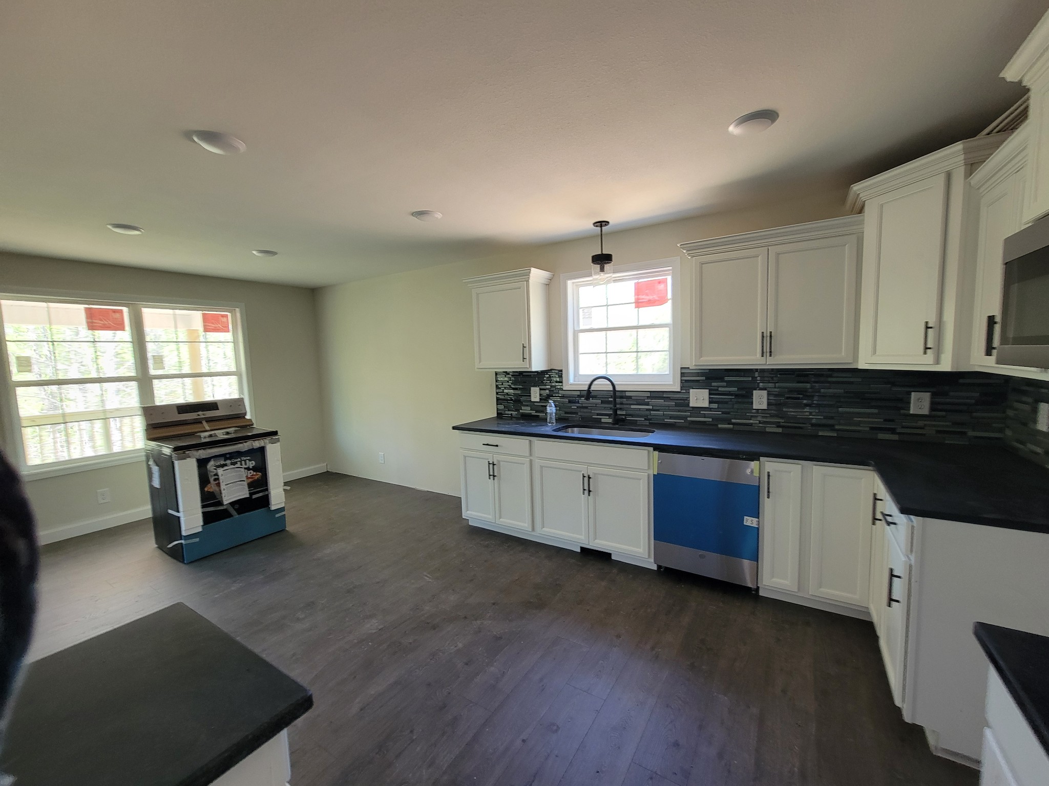 2265 Mockingbird Hill Road Palmyra, TN 37142 - Photo 22 of 24 a kitchen with granite countertop a stove a sink and a granite counter tops