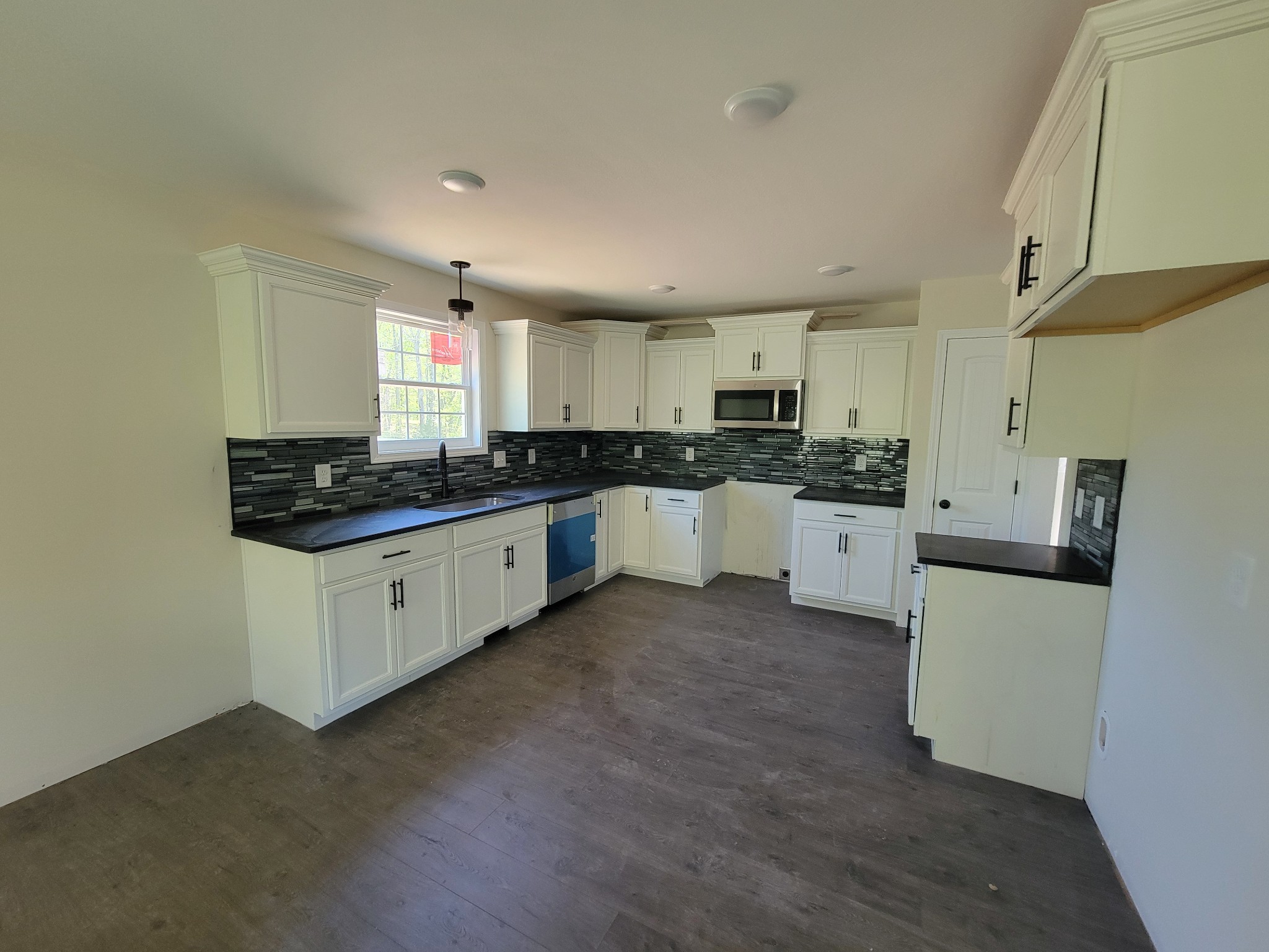2265 Mockingbird Hill Road Palmyra, TN 37142 - Photo 4 of 24 a kitchen with stainless steel appliances kitchen island granite countertop a sink and cabinets