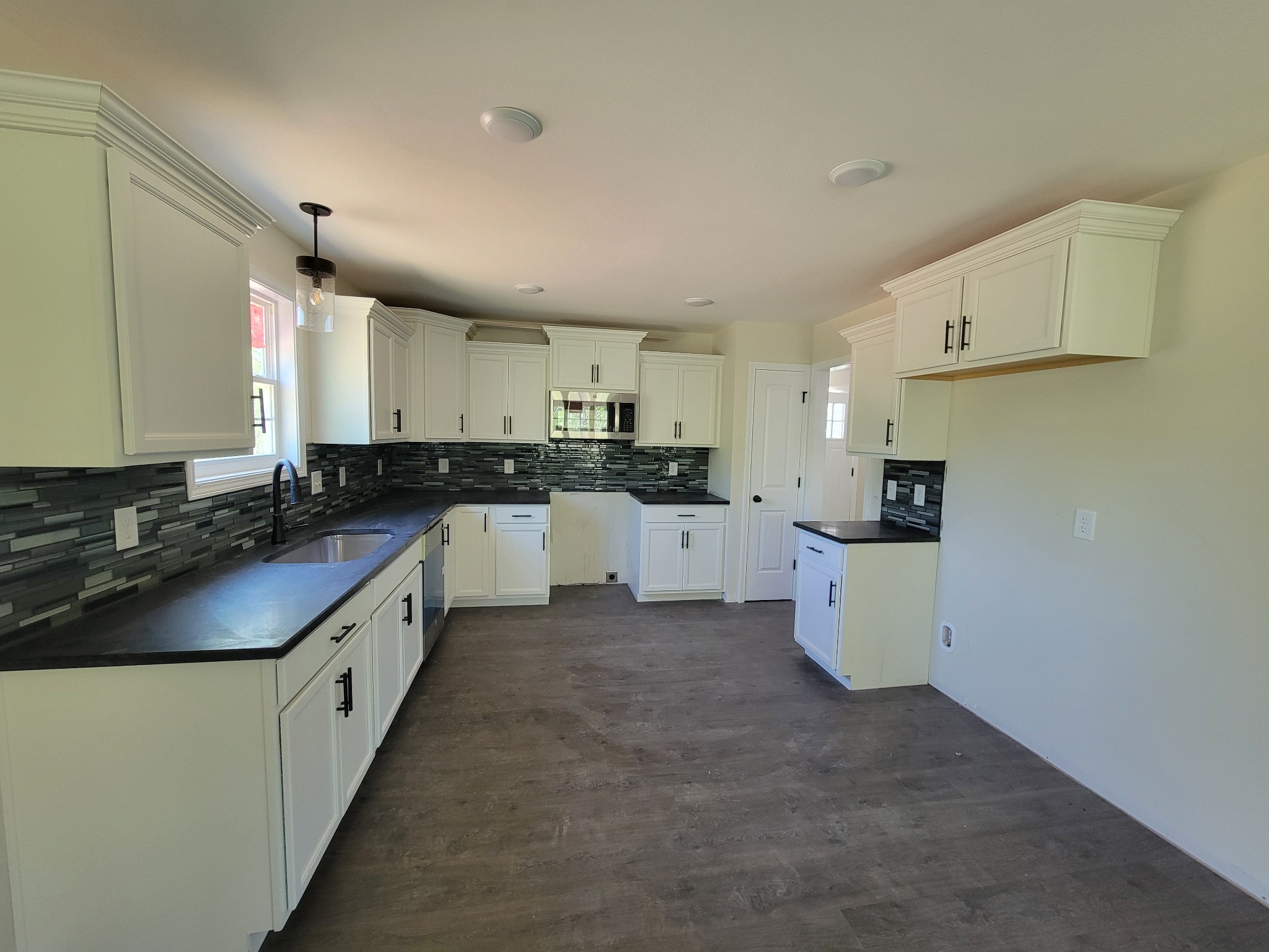 2265 Mockingbird Hill Road Palmyra, TN 37142 - Photo 5 of 24 a large kitchen with cabinets