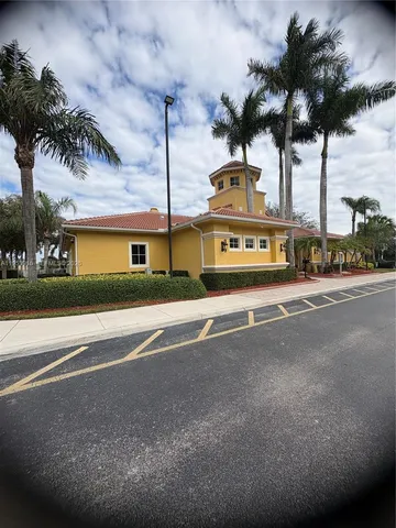 a view of a street with a building in the background