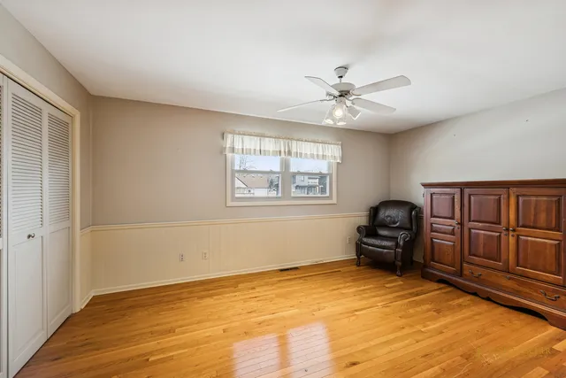a view of livingroom with furniture hardwood floor and workspace