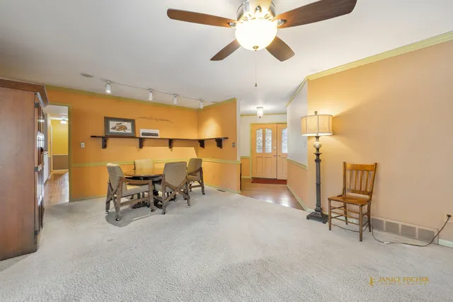 a view of a dining room with furniture window and outside view