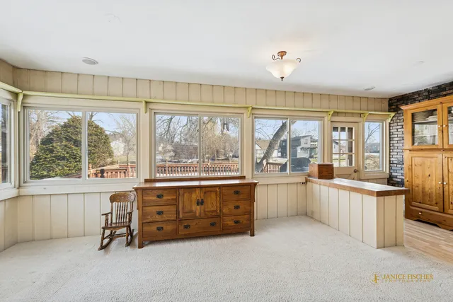 a living room with furniture and windows