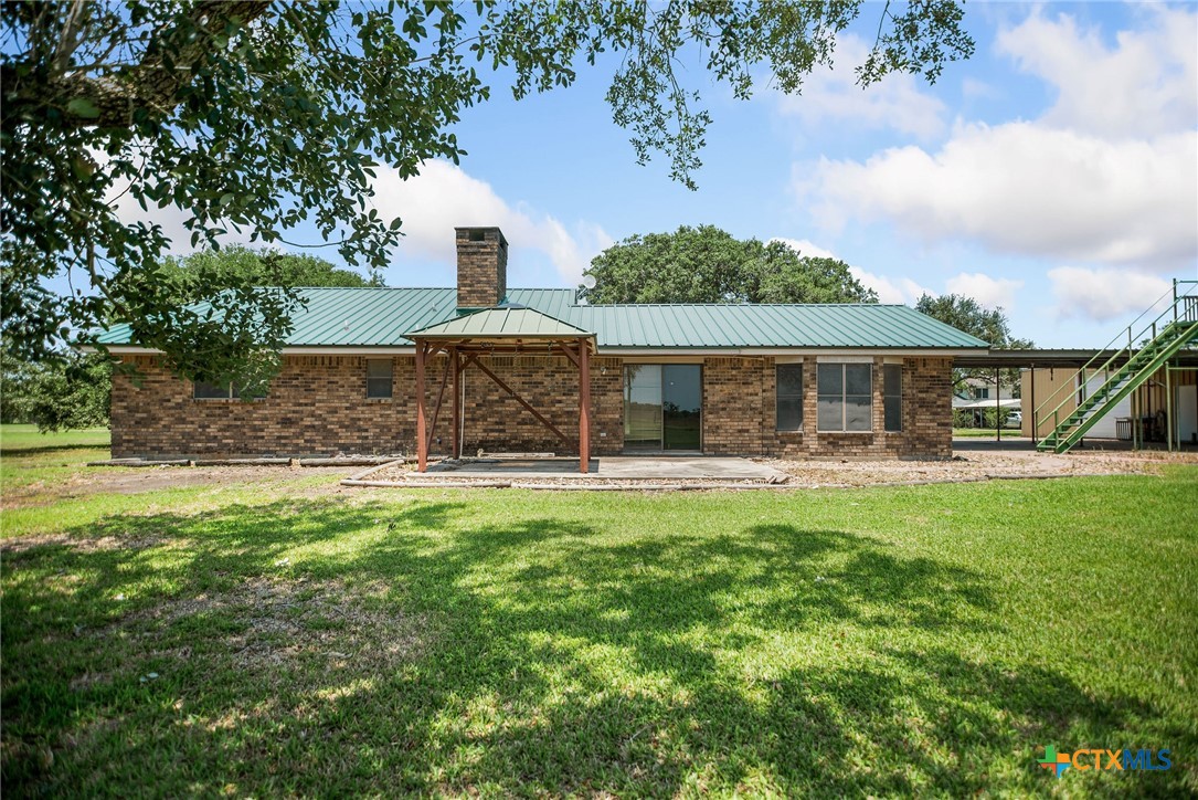 181 Pecan Street Port Lavaca, TX 77979 - Photo 28 of 34 a front view of a house with a garden