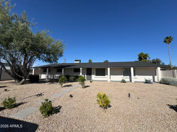a kitchen with stainless steel appliances kitchen island granite countertop a refrigerator and a stove top oven