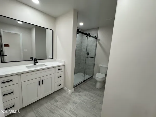 a bathroom with a double vanity sink and mirror