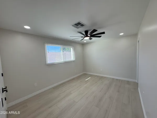 a bathroom with a sink mirror toilet and shower