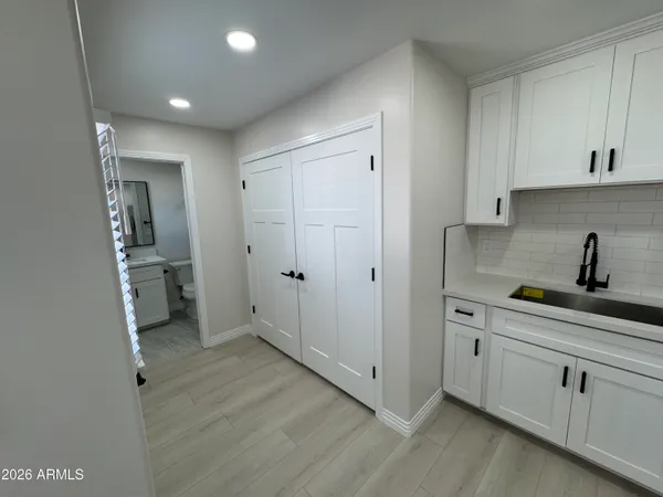 a bathroom with a shower toilet and sink