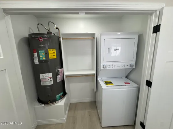 a view of a hallway with a refrigerator