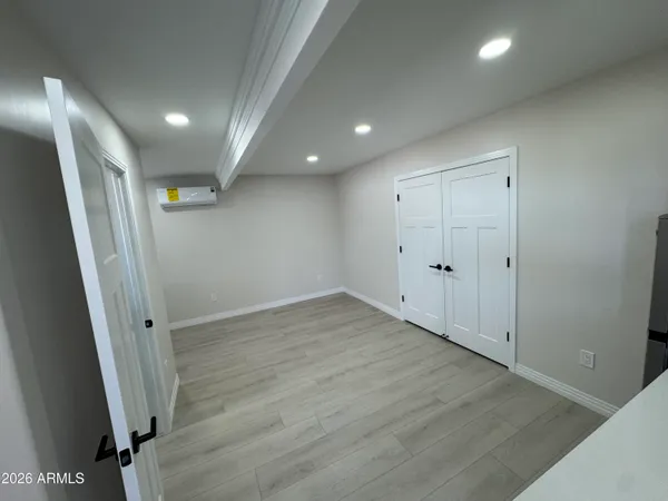 a view of an empty room with a fireplace