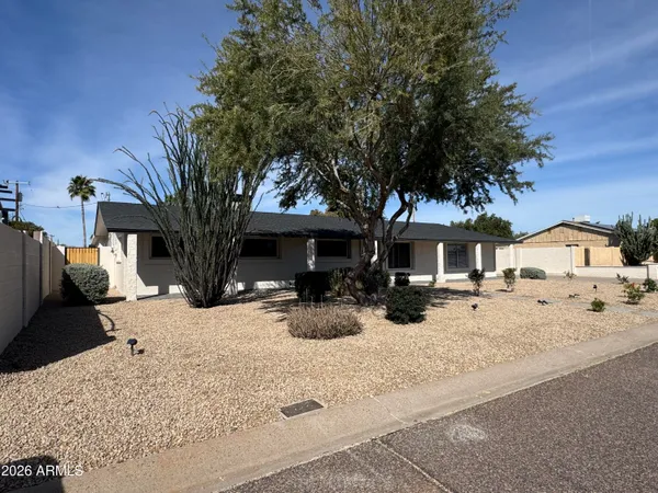 a view of a house with snow on the road