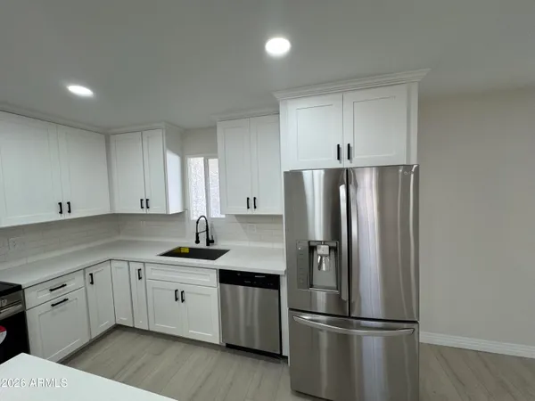 an empty room with a empty space and windows