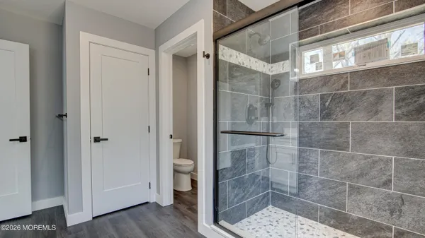 a bathroom with a glass shower door
