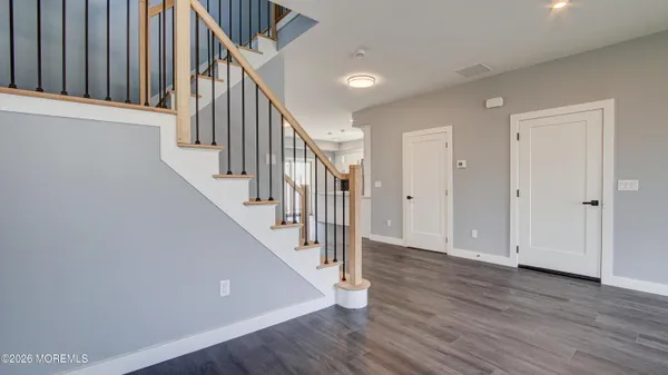 a view of entryway with wooden floor
