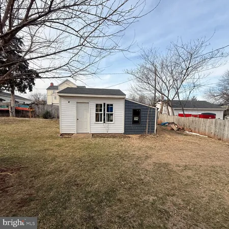 a backyard of a house with stainless steel appliances