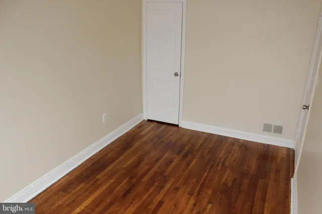 a view of wooden floor in an empty room