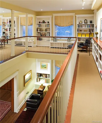 a view of a brick building next to a yard