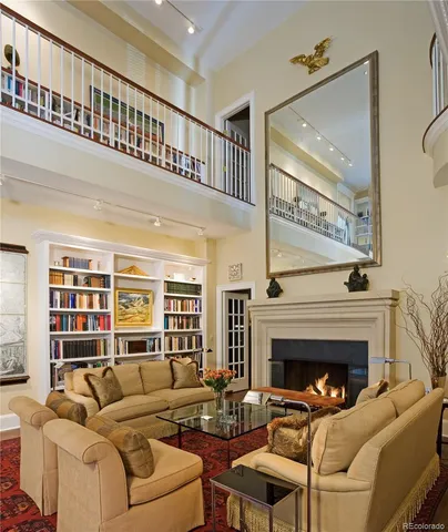 a living room with furniture a rug and a window