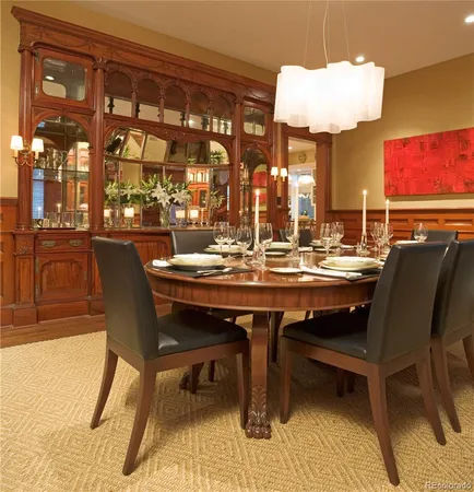 a view of a kitchen with furniture and a potted plant