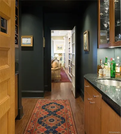 a view of a hallway with wooden shelves