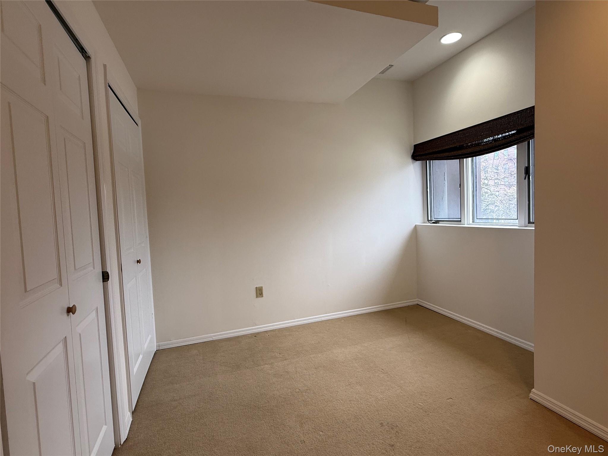 130 South Middle Neck Road, Unit 2 Great Neck, NY 11021 - Photo 12 of 22 a view of an empty room with a window