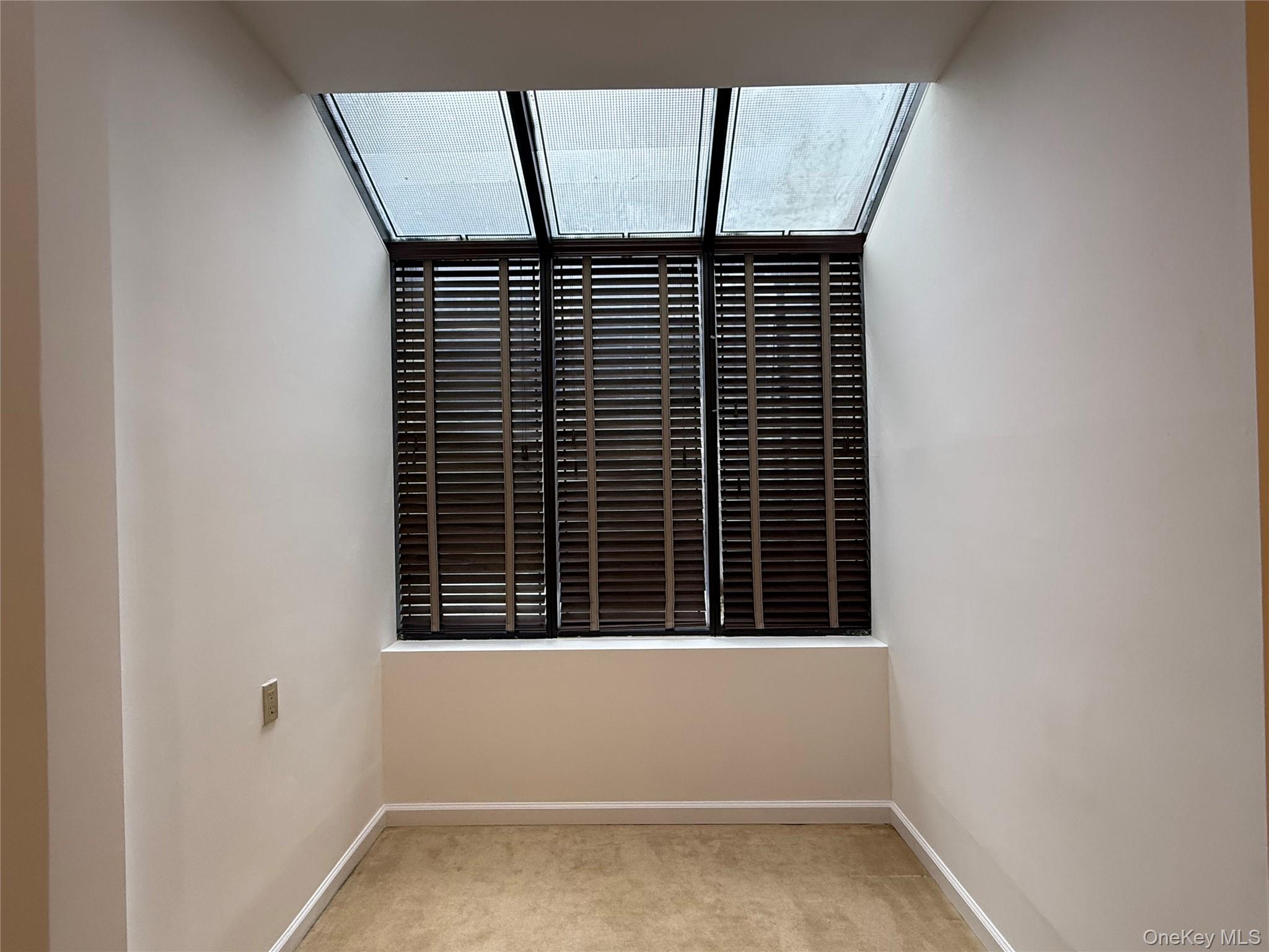 130 South Middle Neck Road, Unit 2 Great Neck, NY 11021 - Photo 8 of 22 a view of empty room with windows