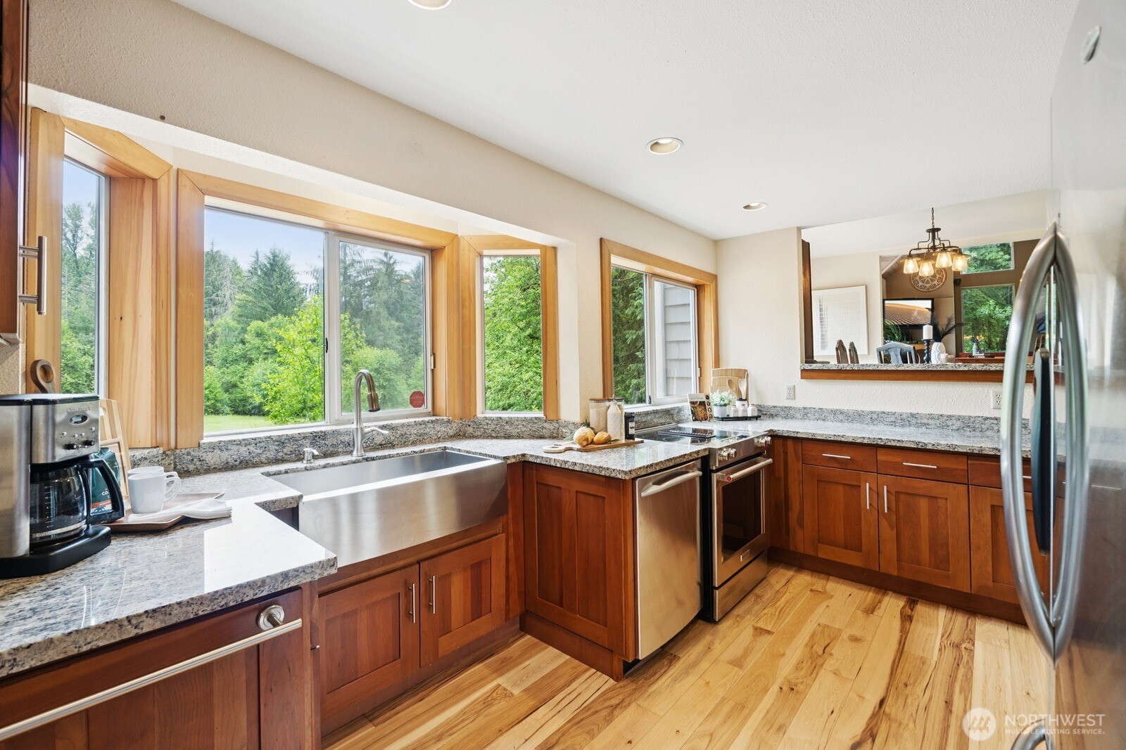 45908 Southeast Edgewick Road North Bend, WA 98045 - Photo 11 of 40 a kitchen with stainless steel appliances granite countertop sink stove top oven and cabinets