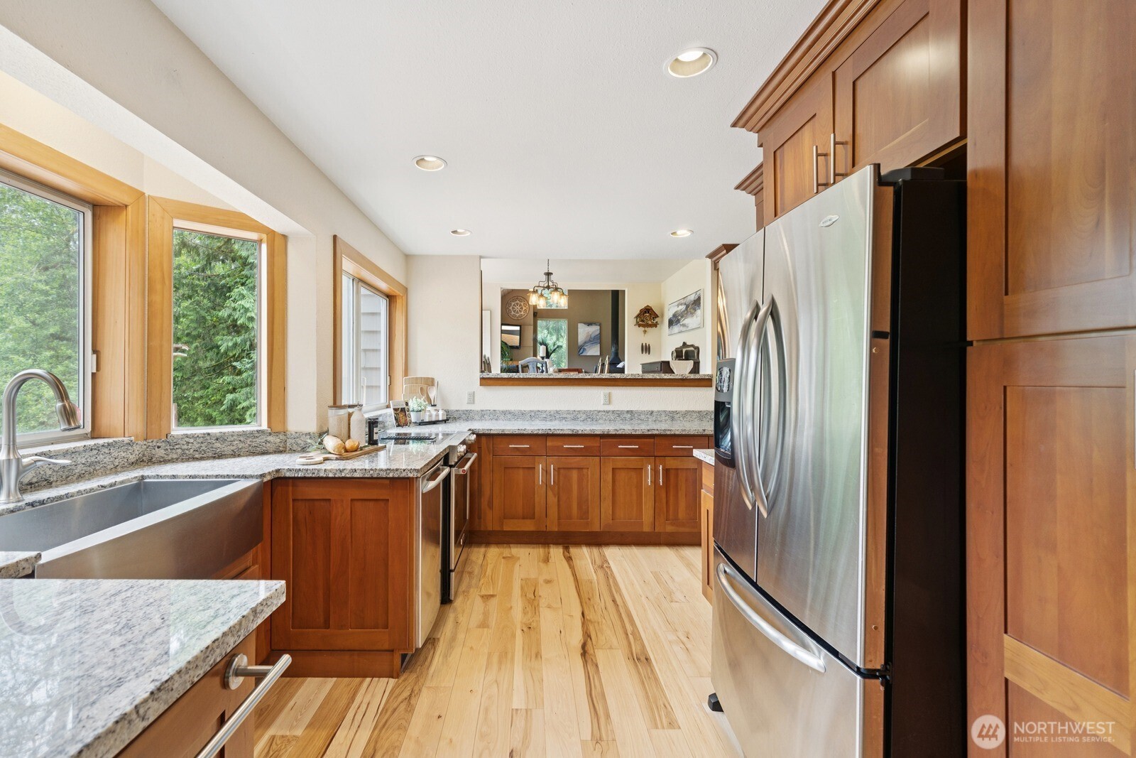 45908 Southeast Edgewick Road North Bend, WA 98045 - Photo 12 of 40 a kitchen with stainless steel appliances granite countertop a refrigerator a sink and a stove