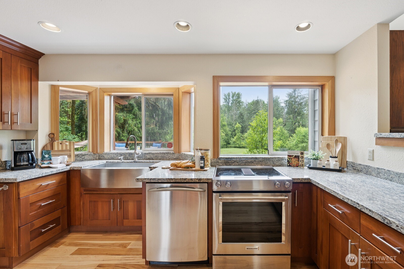 45908 Southeast Edgewick Road North Bend, WA 98045 - Photo 13 of 40 a kitchen with stainless steel appliances a stove sink and microwave