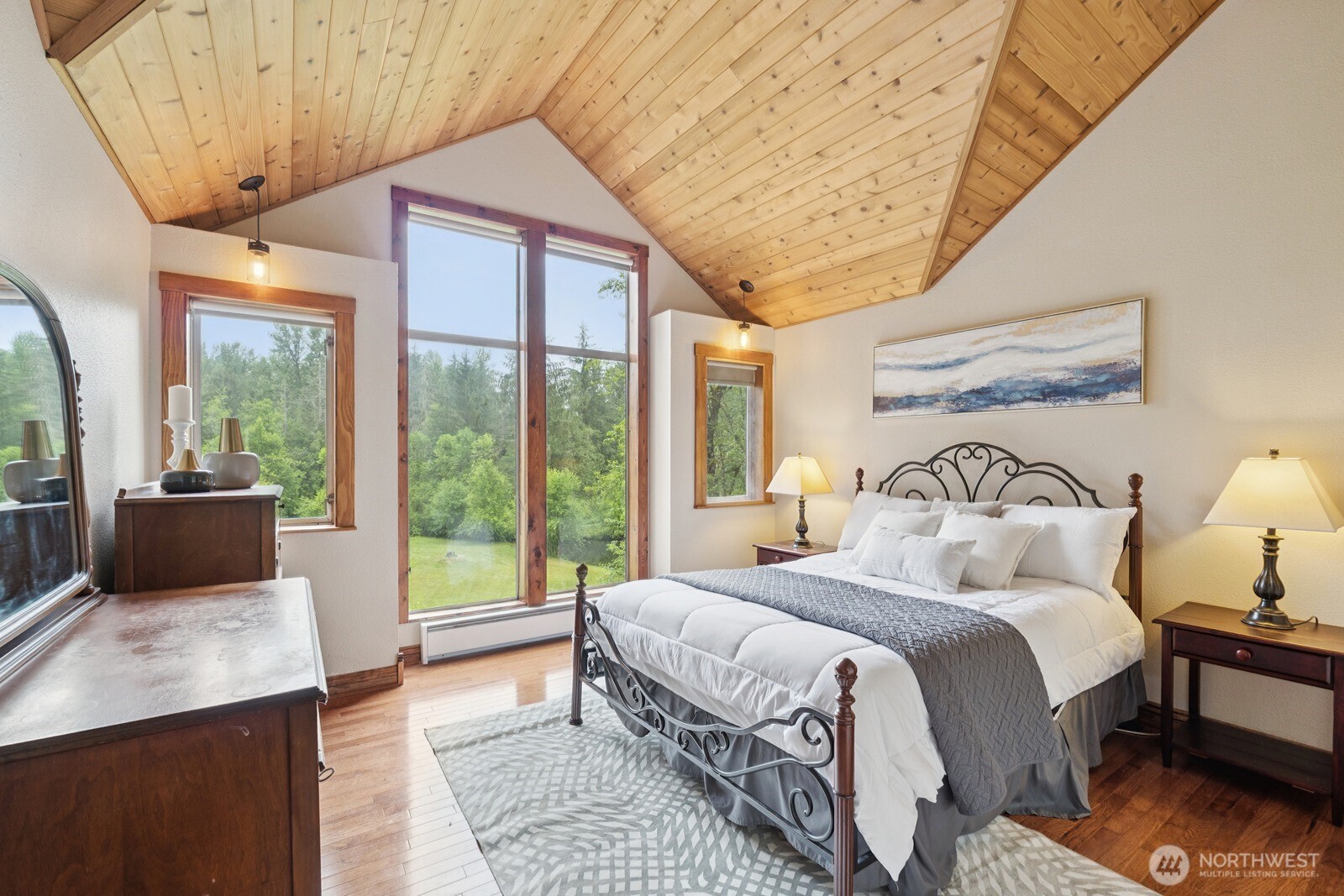 45908 Southeast Edgewick Road North Bend, WA 98045 - Photo 17 of 40 a bedroom with a large bed and a balcony