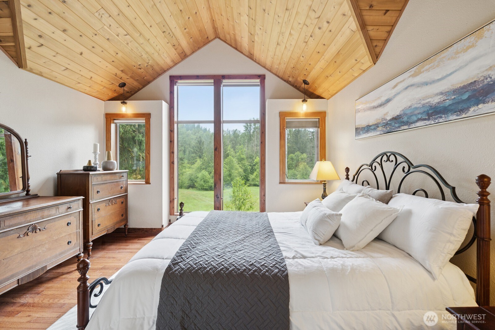 45908 Southeast Edgewick Road North Bend, WA 98045 - Photo 18 of 40 a bedroom with a large bed and a large window