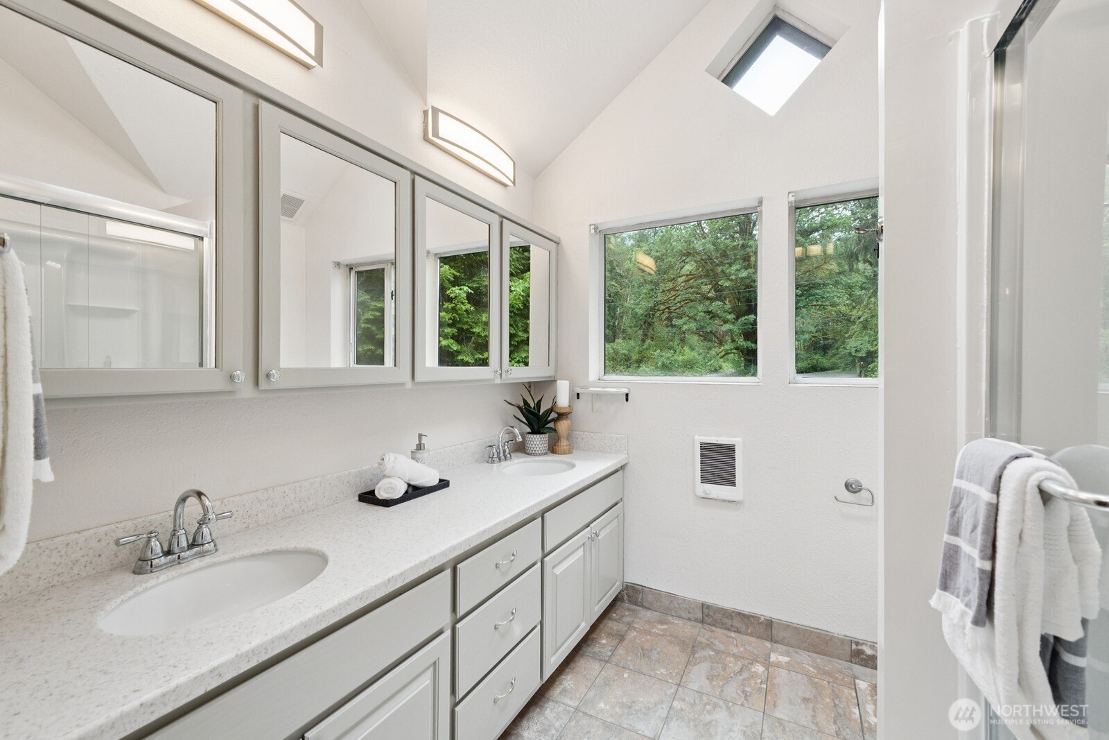 45908 Southeast Edgewick Road North Bend, WA 98045 - Photo 19 of 40 a bathroom with a double vanity sink and mirror