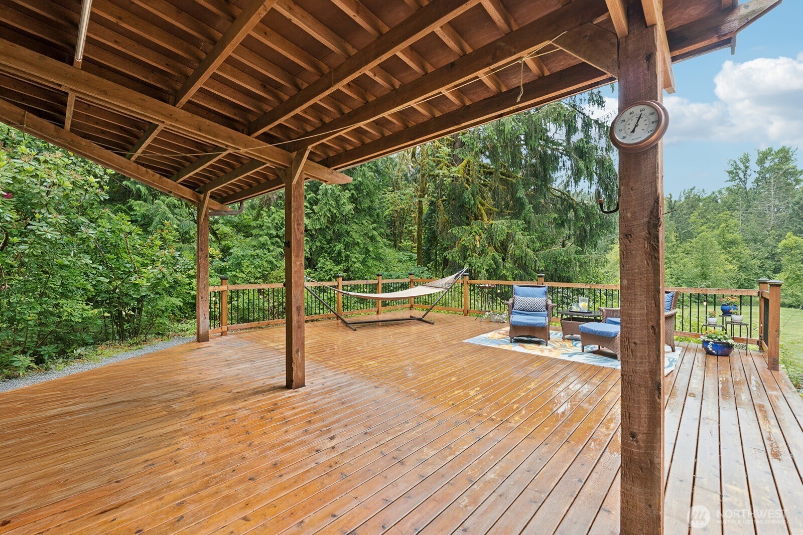 45908 Southeast Edgewick Road North Bend, WA 98045 - Photo 30 of 40 a patio with glass top table and chairs