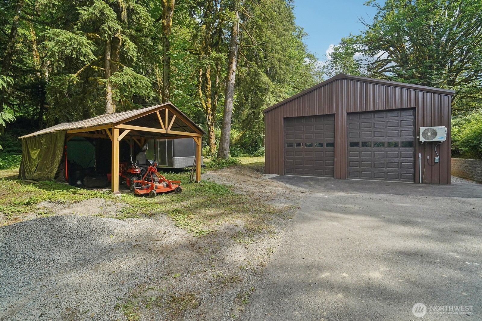 45908 Southeast Edgewick Road North Bend, WA 98045 - Photo 32 of 40 a view of a wooden house with a small yard and wooden fence