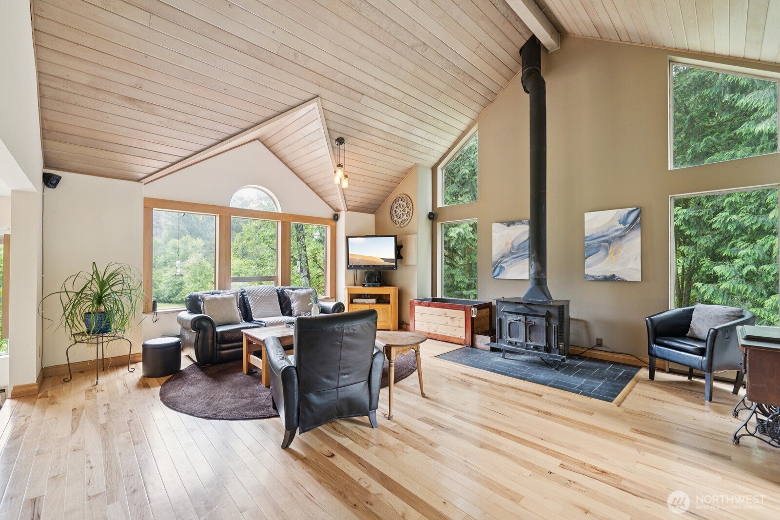 45908 Southeast Edgewick Road North Bend, WA 98045 - Photo 8 of 40 a living room with furniture large windows and wooden floor