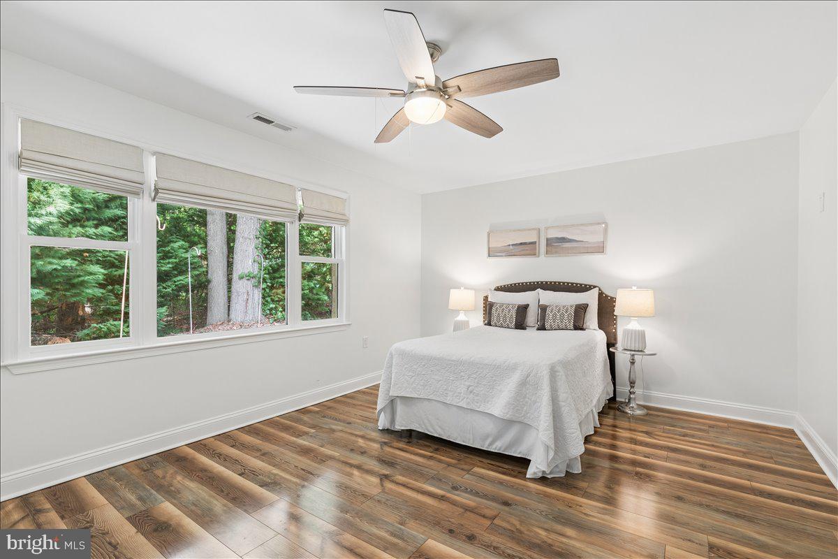 102 Little Neck Road Stevensville, MD 21666 - Photo 35 of 77 a bedroom with a large bed and a window