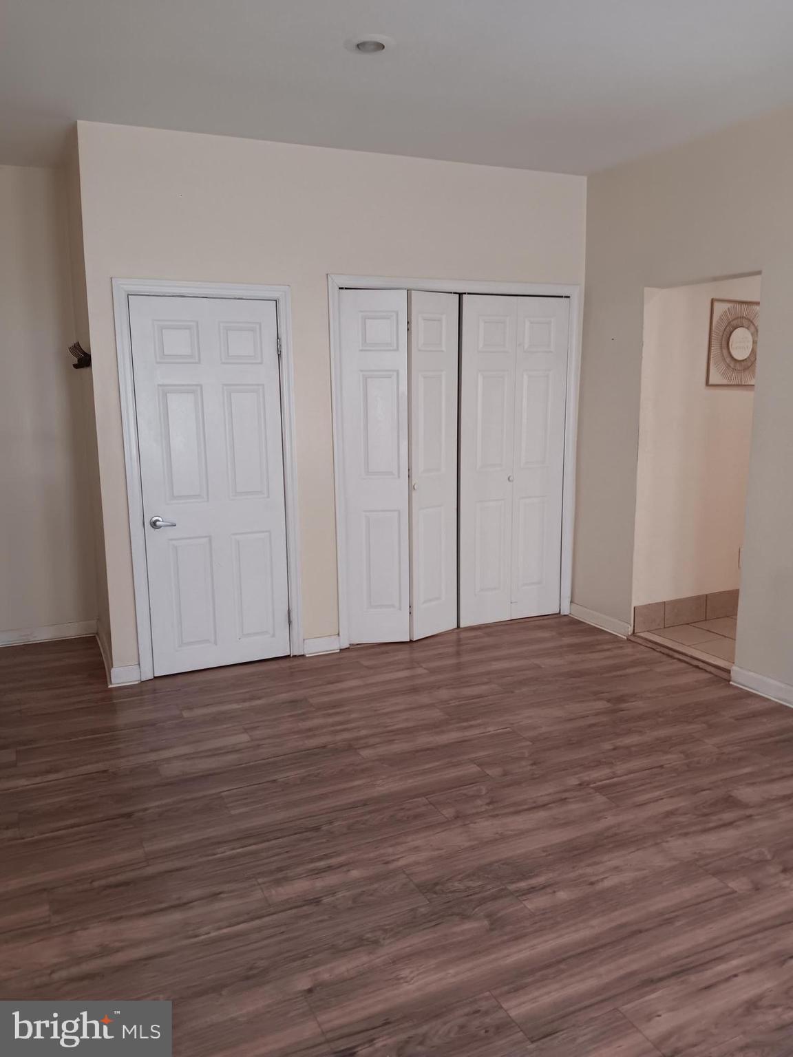 712 Central Avenue, Unit B Glendora, NJ 08029 - Photo 5 of 11 a view of empty room with wooden floor