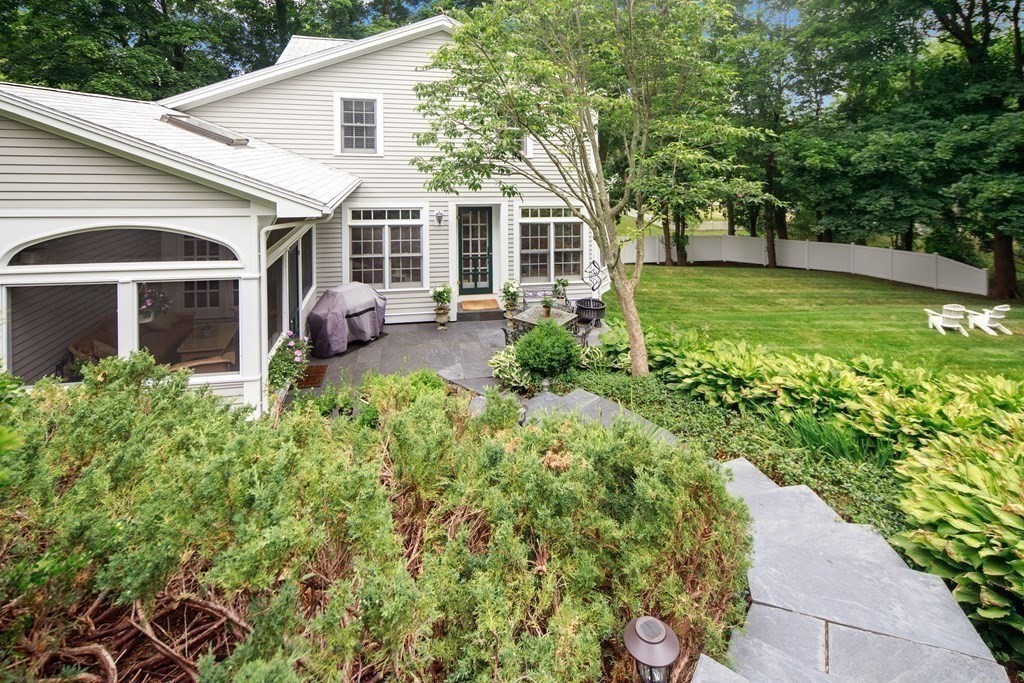 6 Bishops Lane Hingham, MA 02043 - Photo 16 of 22 a front view of a house with garden