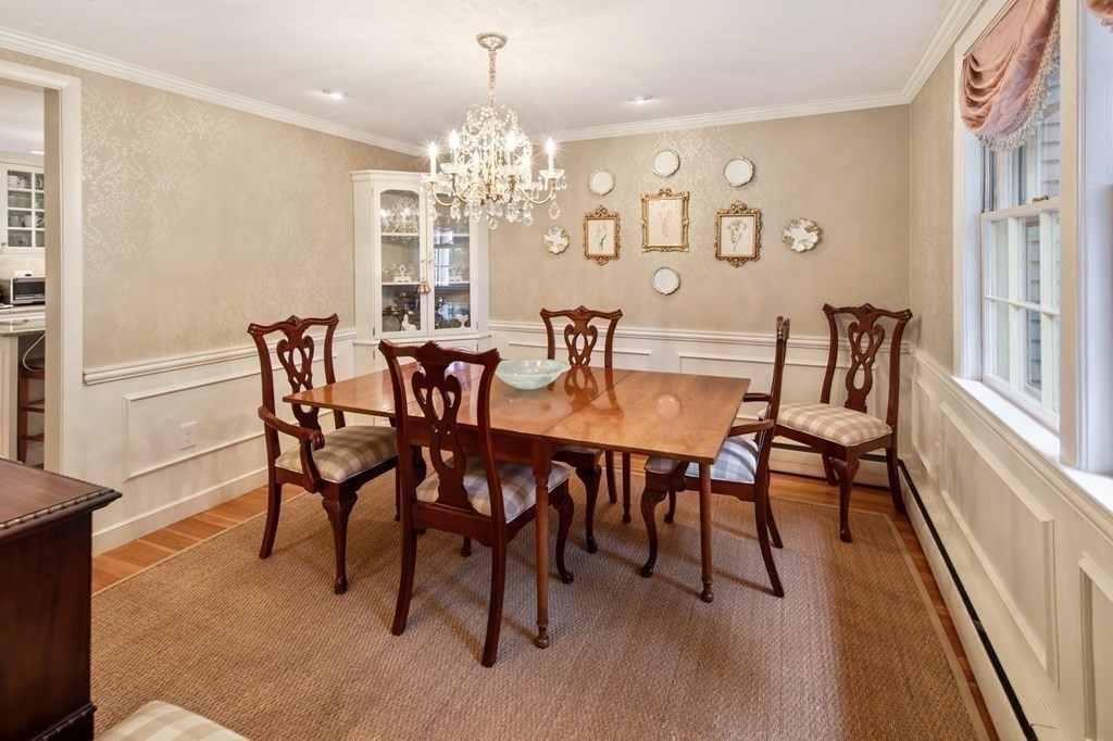 6 Bishops Lane Hingham, MA 02043 - Photo 8 of 22 a view of a dining room with furniture a chandelier and wooden floor