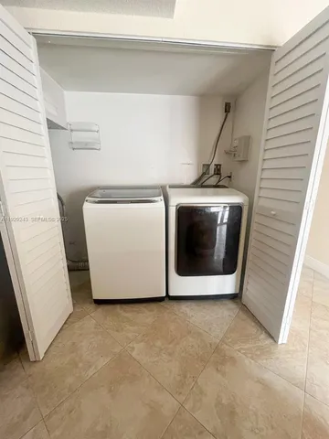 a utility room with a washer and dryer