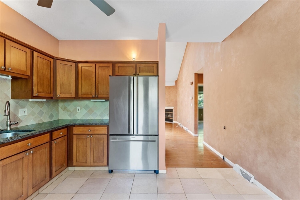 9 Fillmore Road, Unit 9C Salem, MA 01970 - Photo 11 of 22 a kitchen with stainless steel appliances granite countertop a refrigerator a sink and dishwasher