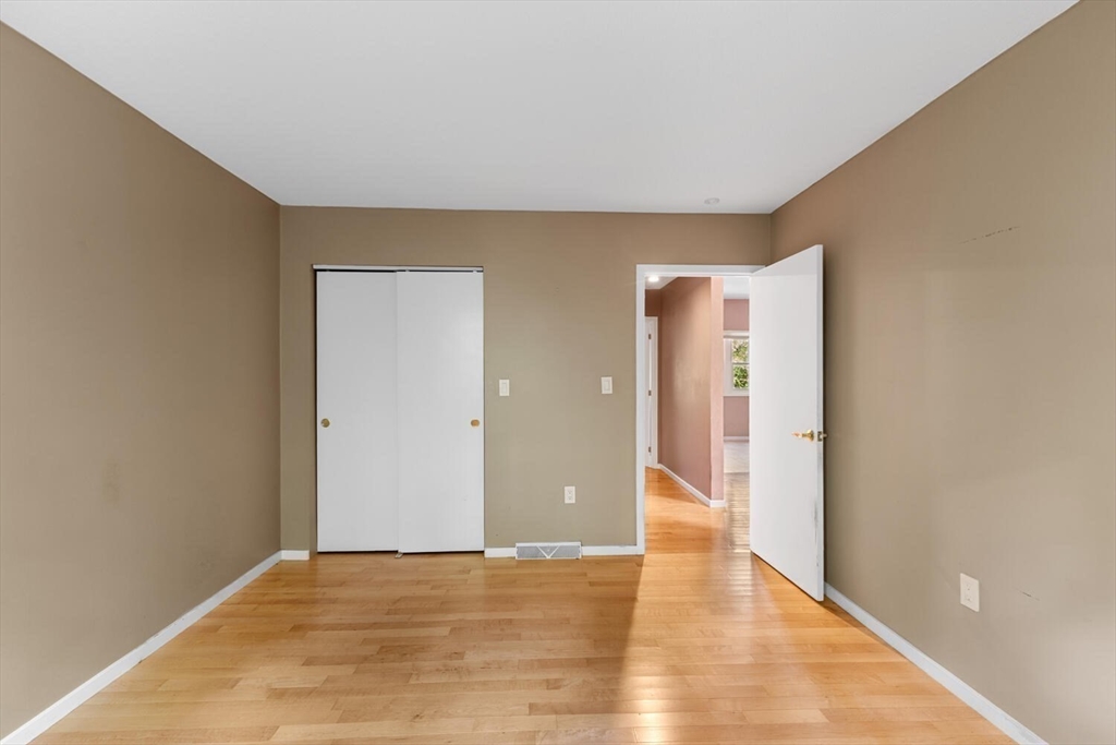 9 Fillmore Road, Unit 9C Salem, MA 01970 - Photo 15 of 22 a view of an empty room with wooden floor